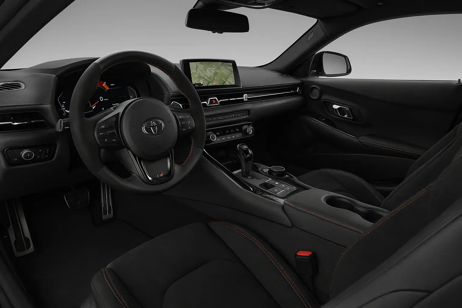 Interior del Toyota GR Supra 2025 con asientos RECARO, acabados en Alcantara y detalles en fibra de carbono