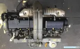 Imagen detallada del motor Toyota 1HZ, destacando sus componentes.